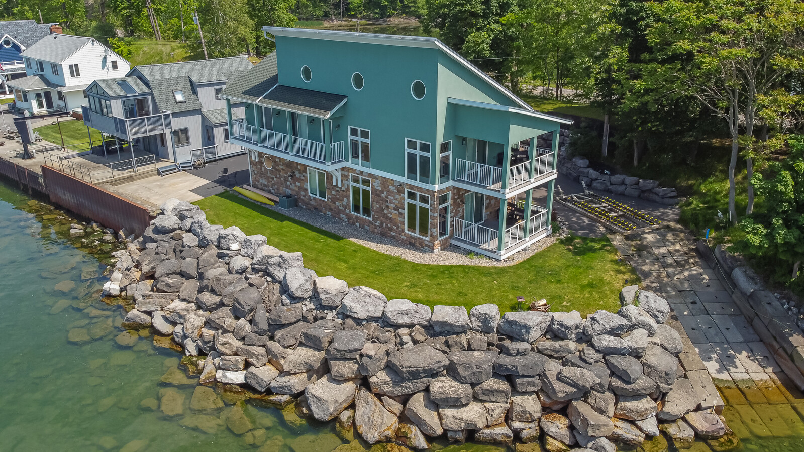 344 Lake Road beside Lake Ontario, showing the house, decks and shoreline